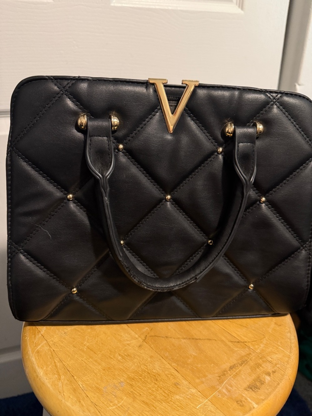 Black Quilted Top-Handle Satchel with Gold V Accent